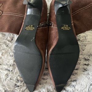 Brown suede western style boots with kitten heel.